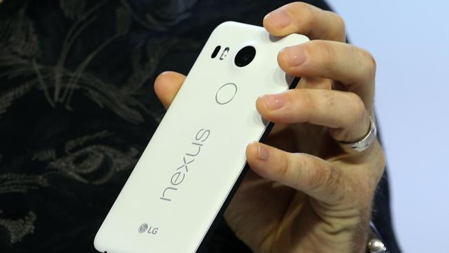 Fingerprint scanners built in ... Google engineering vice-president Dave Burke shows off the new Nexus 5X phone. Picture: Justin Sullivan/Getty Images/AFP