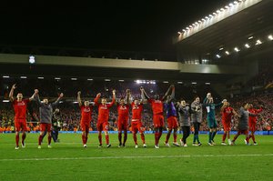 Liverpool players celebrate at the end of the game after the UEFA Europa League Quarter Final Second Leg match between Liverpool and Borussia Dortmund played at Anfield