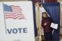 Melanie Harrison, from Winchester, N.H., exits the voting area at a Winchester, N.H. polling station during the New ...