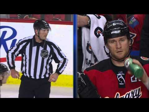 NHL Calgary Flames #6 Dennis Wideman hits Referee #91 Don Henderson on January 27th, 2016