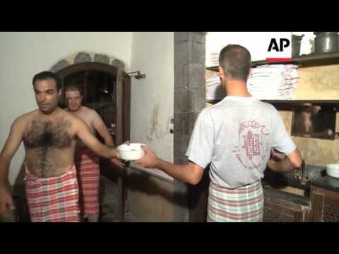 Men enjoy bathing at ancient Damascus hammam