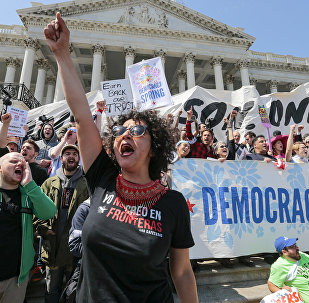 Alejandra Pablos of Arizona leads a chant as voting rights reform demonstrators stage a sit-in at the Capitol in Washington.