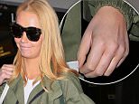 Iggy Azalea without engagement ring at lax friday april 15, 2016 \n/X17online.com