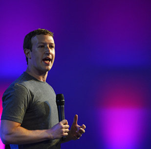 US chairman and chief executive of Facebook Mark Zuckerberg gestures as he announces the Internet.org Innovation Challenge in India in New Delhi on October 9, 2014.