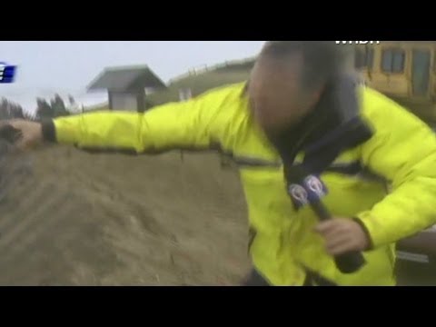 Reporters hang on for dear life in Hurricane Sandy