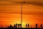 A friday night on Derby Wharf, WA. A sunset in July. Fisherfolk, grey nomads, kid's on bikes, blokes having a beer. I ...