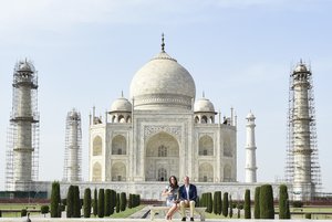 Britain's Prince William, along with his wife, Kate, the Duchess of Cambridge, pose in front of the Taj Mahal in Agra, India, Saturday, April 16, 2016.