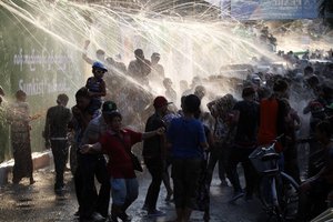 Revelers are splashed with water during Myanmar traditional new year Thingyan water Festival