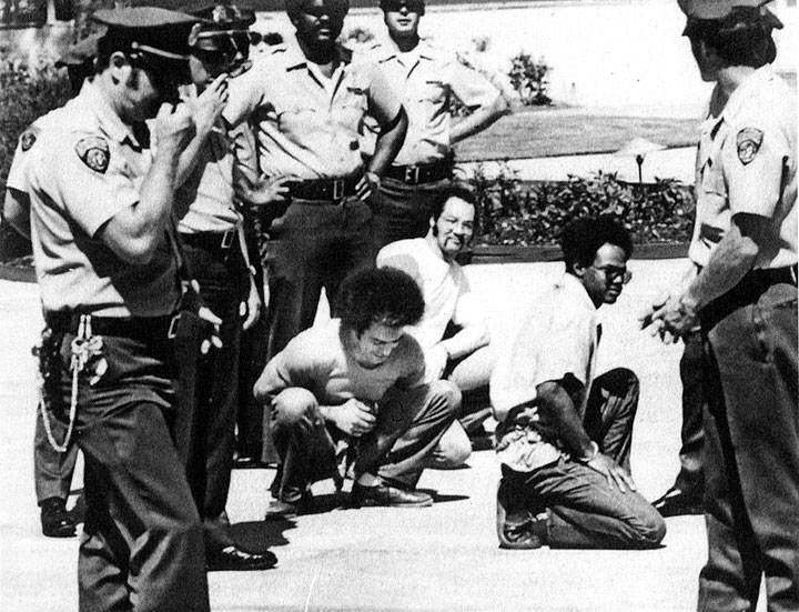 San Quentin 6 defendants Fleeta Drumgo, Hugo Pinell, and David Johnson stage an impromptu sit-in at San Quentin in 1975 when trial jurors toured the prison