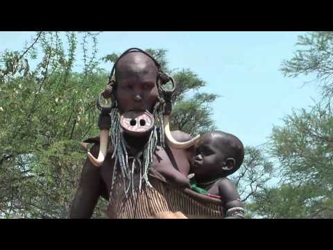 Mursi people - native African tribes in the Omo valley in South of Ethiopia