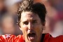 The evergreen Brad Hogg of the Scorchers celebrates after taking the wicket of Nathan Reardon.