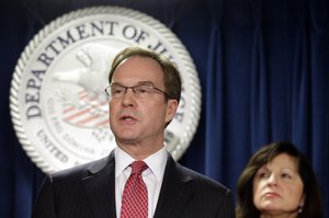 Michigan Attorney General Bill Schuette speaks after U.S. Attorney Carmen Ortiz