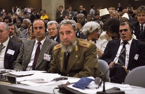 File - Fidel Castro Ruz, President of the Council of State and the Council Ministers of Cuba (right behind table), listens with his delegation to the addresses of Heads of State and Government during a UN Conference on the environment, 12 June, 1992.