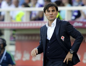 Fiorentina coach Vincenzo Montella watches a Serie A soccer match between Fiorentina and Parma at the Artemio Franchi stadium in Florence, Italy, Monday, May 18, 2015.