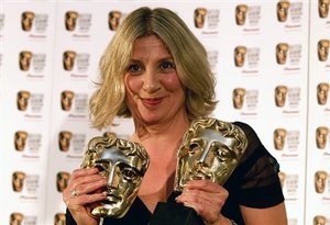  British comedienne Victoria Wood holds her two awards, one for Best Actress and one for Best Single Drama both received for Housewife 49 at the British Academy Television Awards, BAFTA, held in central London Sunday 20 May 2007. (AP Photo/ Max Nash)   (j