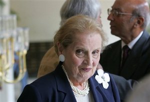 Former U.S. Secretary of State Madeleine Albright arrives to address an interactive session on "America, India and Democracy in the 21st Century" in New Delhi, India, Tuesday, Sept. 5, 2006. The session was organized by The Aspen Institute India and Confederation of Indian Industry. Also seen background right is President of The Aspen Institute India Tarun D