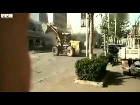 Chinese bulldozers battle in the street