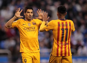 Barcelona's Luis Suarez, left, and Neymar celebrate after scoring a goal during a Spanish La Liga soccer match between Deportivo and Barcelona at the Riazor stadium in A Coruna, Spain, Wednesday, April 20, 2016.