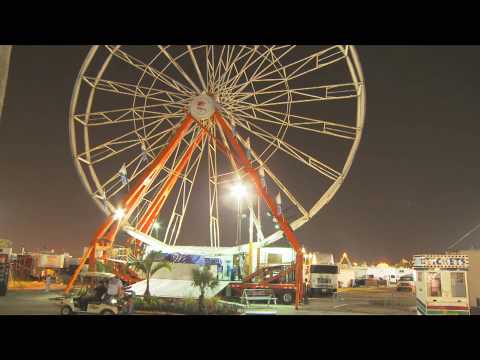 HD Time Lapsed Transforming Ferris Wheel -  Carnival Rides - HD Stock Footage