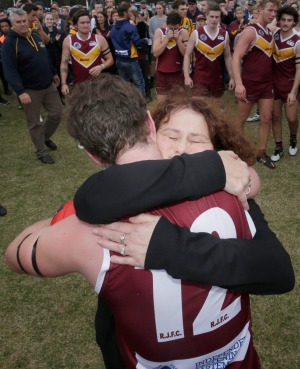 MELBOURNE, AUSTRALIA - APRIL 23:  Lucas Cronin and his mother embrace after the match between the Lower Plenty Bears and ...