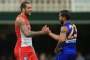 Lance Franklin of the Swans and Lewis Jetta of the Eagles greet each other after the game.