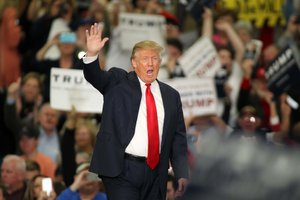 Republican presidential candidate Donald Trump waves during a campaign event at the Myrtle Beach Convention Center on Tuesday, Nov. 24, 2015, in Myrtle Beach, S.C.