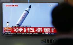 A man watches a TV news program showing a file footage of a missile launch conducted by North Korea, at the Seoul Train Station in Seoul, South Korea, Saturday, April 23, 2016.