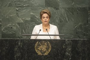 Dilma Rousseff, President of Brazil, addresses the opening segment of the signature ceremony.