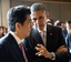 File - President Barack Obama talks with Prime Minister Shinzo Abe of Japan