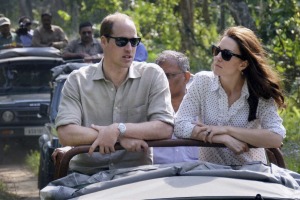 Britain's Prince William, left, and Kate, the Duchess of Cambridge take an open vehicle safari inside the Kaziranga ...