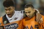 Kevin Naiqama comes off the field injured after a clash with Raiders' Shannon Boyd.