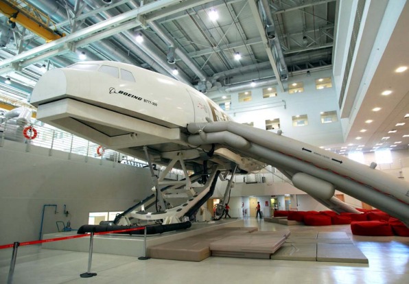 Emergency escape chutes extend from a Boeing B777-300 simluator at the Emirates Aviation College in Dubai.