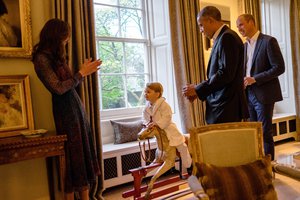 US President Barack Obama and Prince William while Catherine Duchess of Cambridge plays with Prince George at Kensington Palace during visit to Britain.