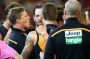 Damien Hardwick talks to his players during a break in the game.