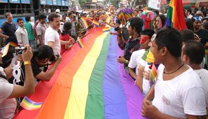 A gay rights activist gestures during a Rainbow Pride rally in Kolkata on July 15, 2012. More than 500 people from the lesbian, gay, bisexual and transgender communities and supporters participated in the annual event to show solidarity and to create awareness about their basic rights