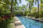 The breath taking pool surrounded by lush gardens : Tranquility @ Thorntons in Port Douglas