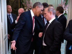 US President Barack Obama talks with Russian President Vladimir Putin