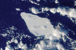 File - This astronaut photograph illustrates the remains of a giant iceberg—designated A22A— that broke off Antarctica in 2002.