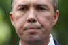 Immigration Minister Peter Dutton addresses the media during a doorstop interview on the Christmas Island situation, at ...