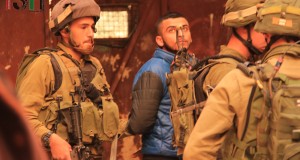 Palestinian arrested by Israeli forces with arm twisted behind his back