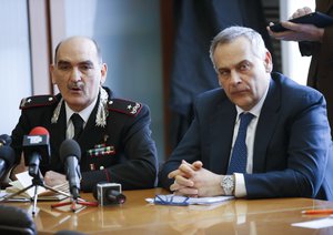 Carabinieri General and chief of ROS (Special Operations Group) Giuseppe Governale, left, sits by head of anti-terrorism unit Lamberto Giannini, during a news conference to illustrate an anti-terrorism operation, in Milan, Italy, Thursday, April 28, 2016.