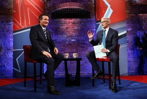 Republican presidential candidate Sen. Ted Cruz, R-Texas, appears with Anderson Cooper during a commercial break at a CNN town hall event, Tuesday, Feb. 16, 2016, in Greenville, S.C.