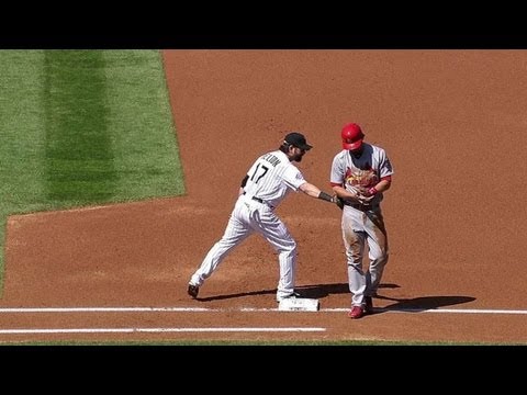 Helton pulls off hidden-ball trick on pickoff