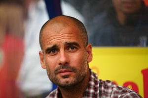 File - Josep "Pep" Guardiola is a Spanish professional football coach and former player who currently manages German side Bayern Munich.