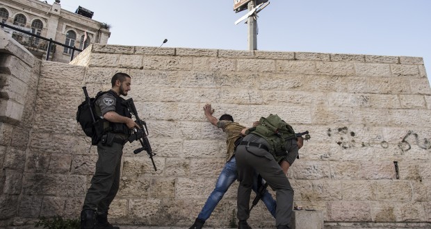 Young men are constantly being stopped, interrogated and searched by occupying forces in front of Damascus Gate and in the old city.  In the top left corner you can see a snipers post on a building overlooking Damascus Gate.  This post was placed without permission from the Palestinian owners.
