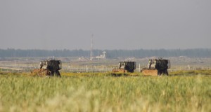 Bulldozers in the fields of Gaza