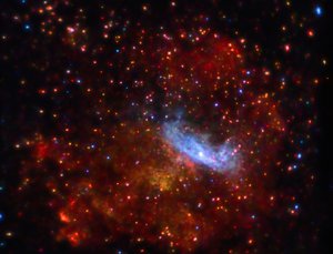 File - A long observation with Chandra of the supernova remnant MSH 11-62 reveals an irregular shell of hot gas, shown in red, surrounding an extended nebula of high energy X-rays, shown in blue.