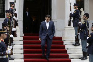 Greece's Prime Minster Alexis Tsipras waits his Portuguese counterpart Antonio Costa at the Maximos Mansion in Athens on Monday, April 11, 2016.