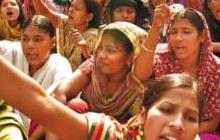 Female garment workers in sit-down demonstration