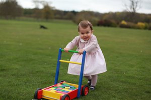 In this undated handout photo released on Sunday, May 1, 2016 by Kensington Palace, Britain's Princess Charlotte poses for a photograph, at Anmer Hall, in Norfolk, England. The princess will celebrate her first birthday on Monday.